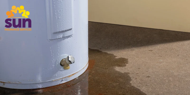 Water leaking from a water heater onto the surrounding floor, with the Sun Insurance Services logo